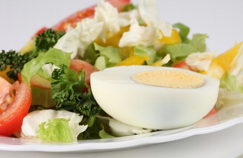 Fresh vegetable salad with hard-boiled eggs in the Maggi . diet menu
